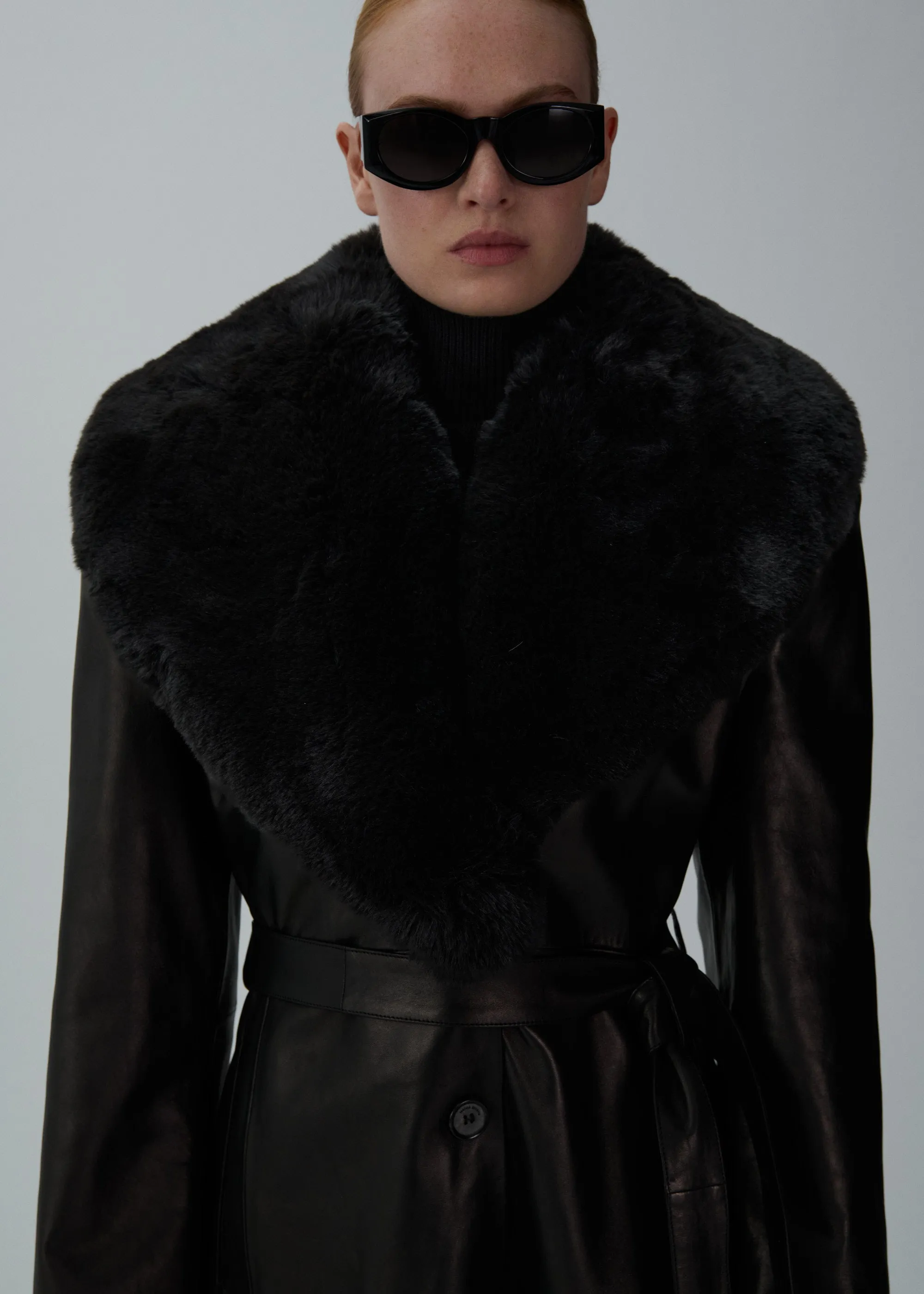 Long faux fur trim belted leather coat in black